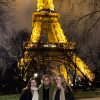 Students standing below the Eiffel Tower