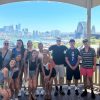 Group of students outside in front of city scape