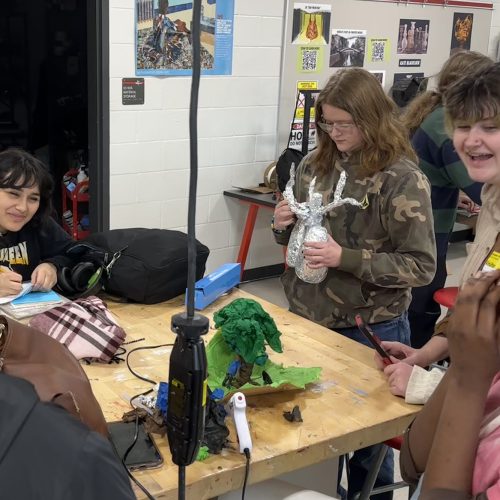 A group of high school students working on a project together